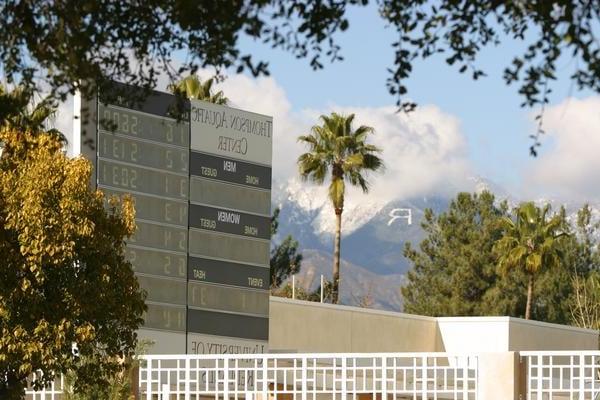 Aquatic center scoreboard with the Redlands R on the mountain in the background